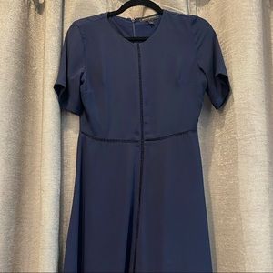Navy empire waist dress hits right below my knee 5’2. Soft material with lining